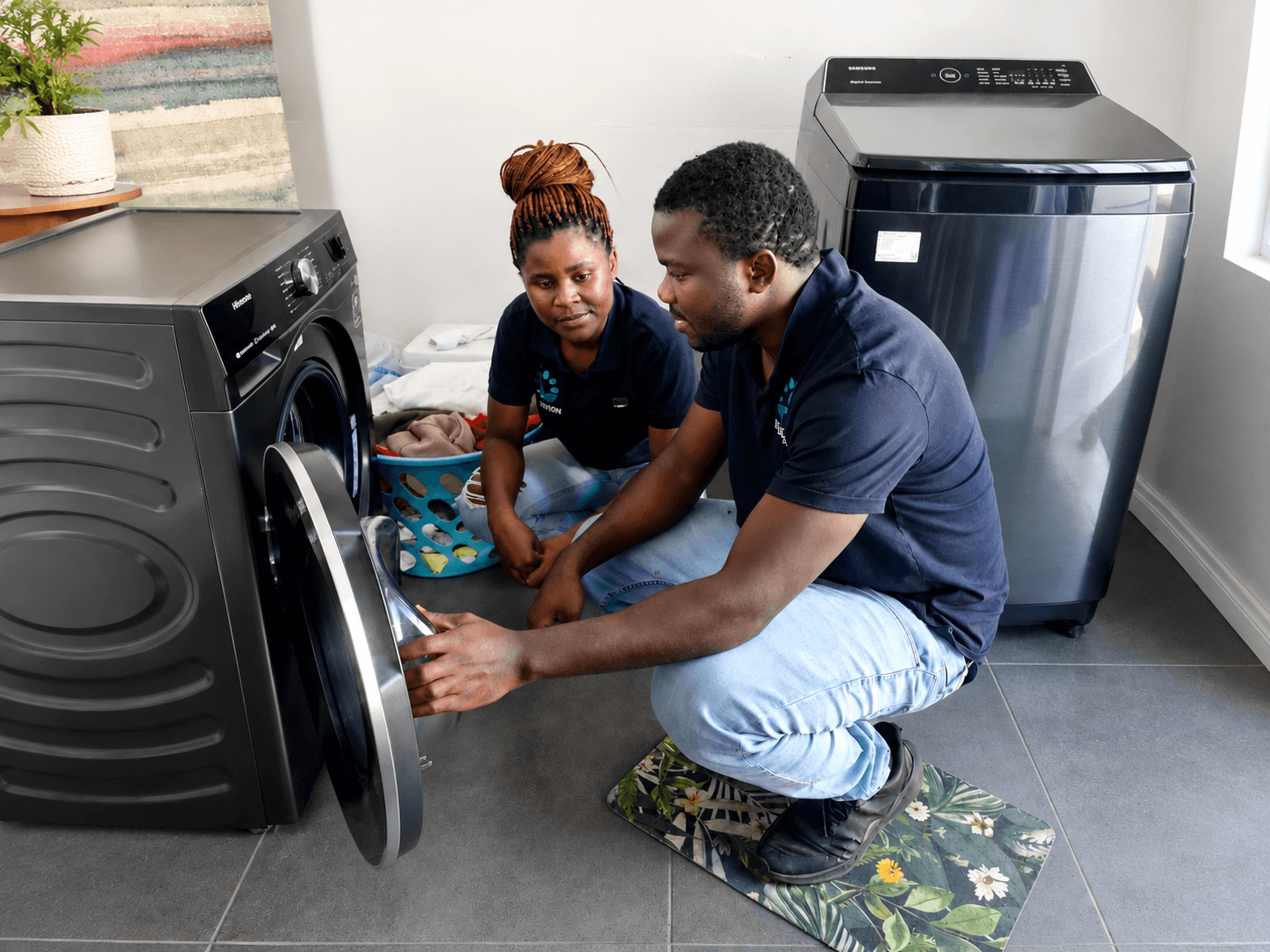 AE Refrigeration technician inspecting a domestic fridge compressor